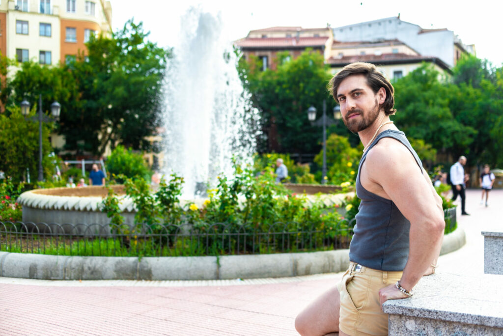 Santiago F C standing by a water fountain in a vest and shorts (Image: Elska)