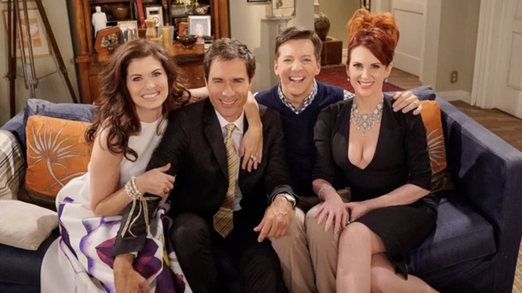 The cast of Will & Grace sat on a sofa