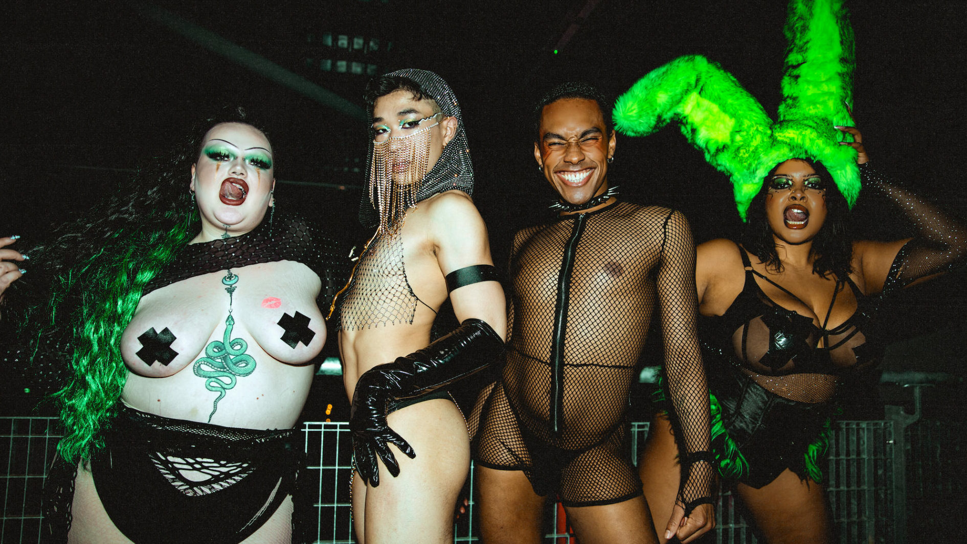 Four party-goers at False Idols show off their outfits