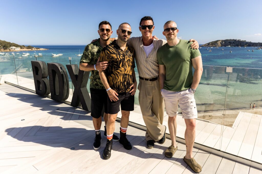 People attending a beach party in Ibiza