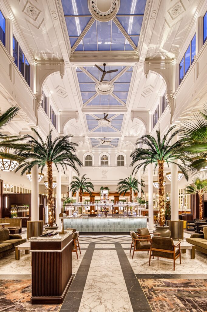 The Palm Court at The Municipal Hotel & Spa in Liverpool, with very high ceilings, palm trees and marble floor (Image: The Municipal Hotel & Spa in Liverpool)