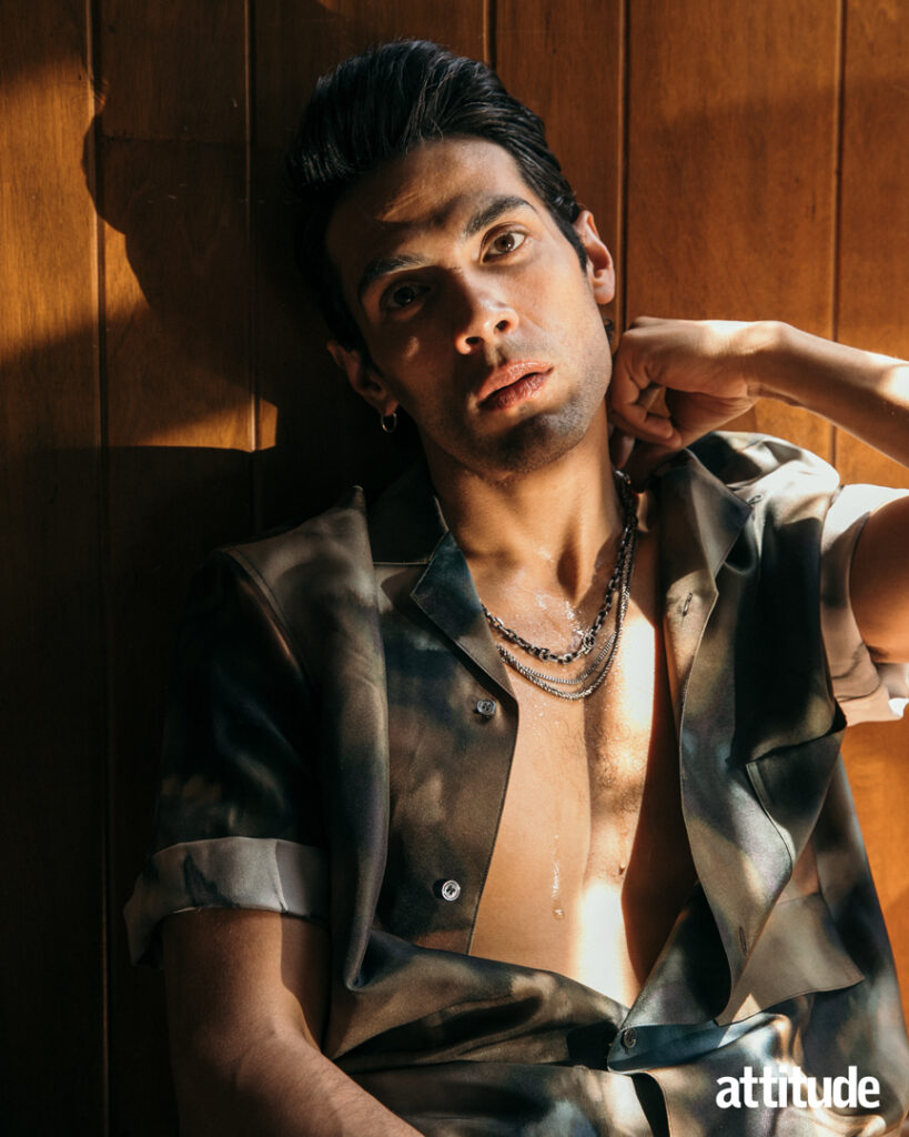 Diego in an open shirt posing in his Attitude cover shoot