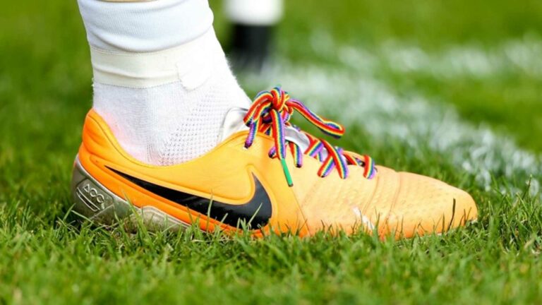 A football boot with rainbow laces