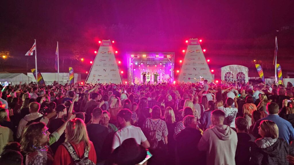 A crowd of people watching the stage at Channel Islands Pride
