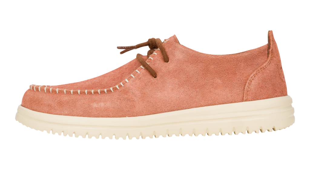 An orange coloured moccasin with beige soles