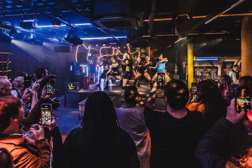the dancers being filmed by attendees