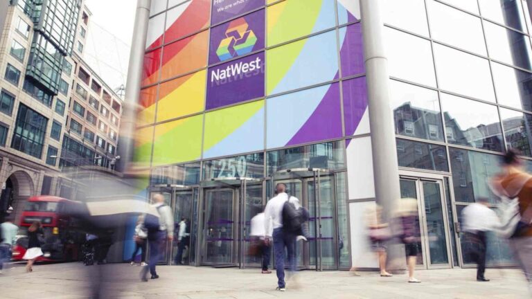 A NatWest Bank with a Pride flag sign