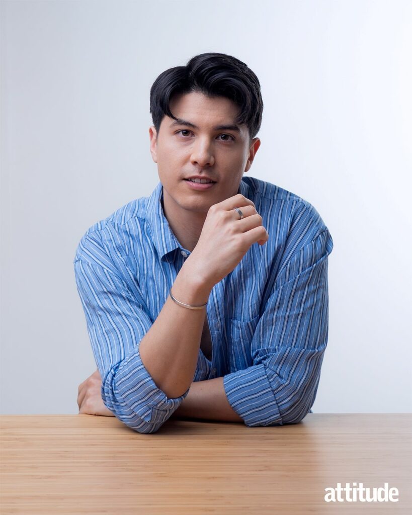 James Phoon sitting at a desk wearing a blue shirt