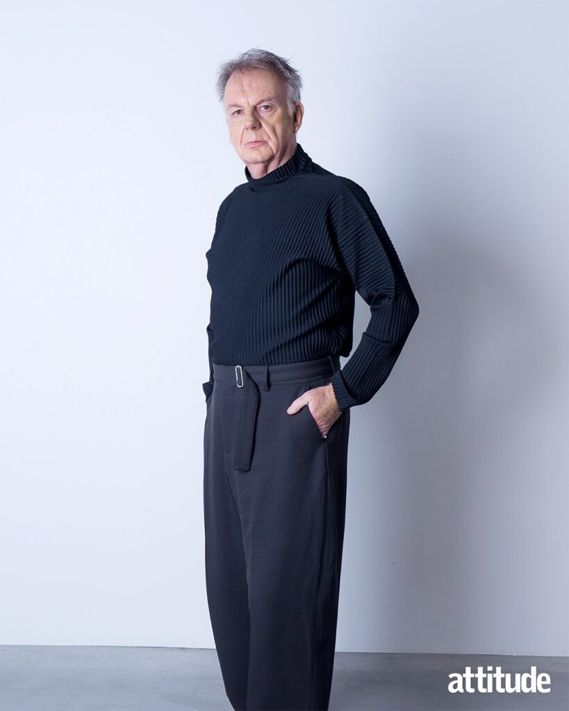 Paul Clayton wearing a black outfit looking into the camera