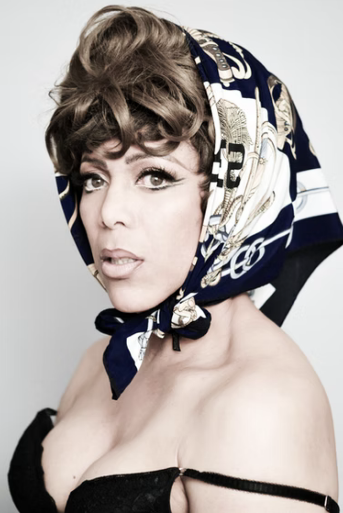 a head and shoulders shot of Mzz Kimberley in a head scarf