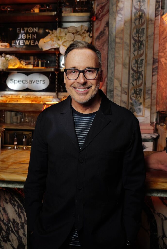 David Furnish at the launch of a Specsavers exclusive Elton John Eyewear collection in a black top and glasses (Image: Jack Hall/PA Media Assignments)