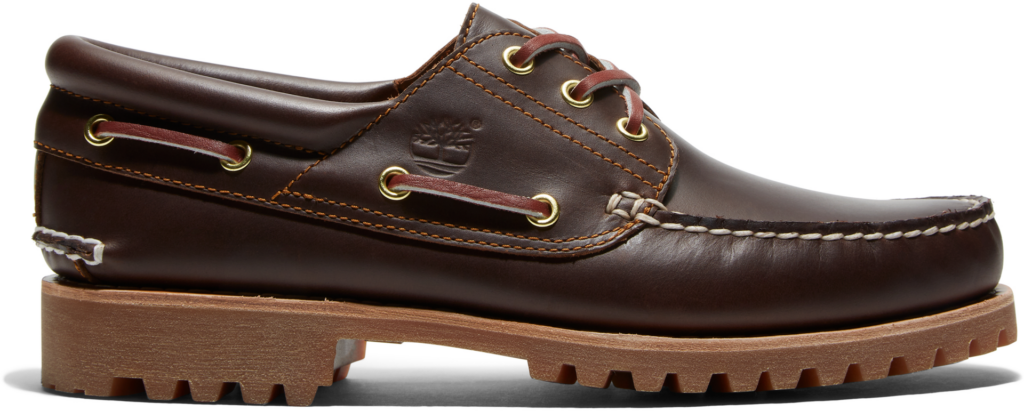 Brown leather boat shoe with contrast stitching, brass eyelets, and a chunky treaded sole, featuring the Timberland logo embossed on the side.