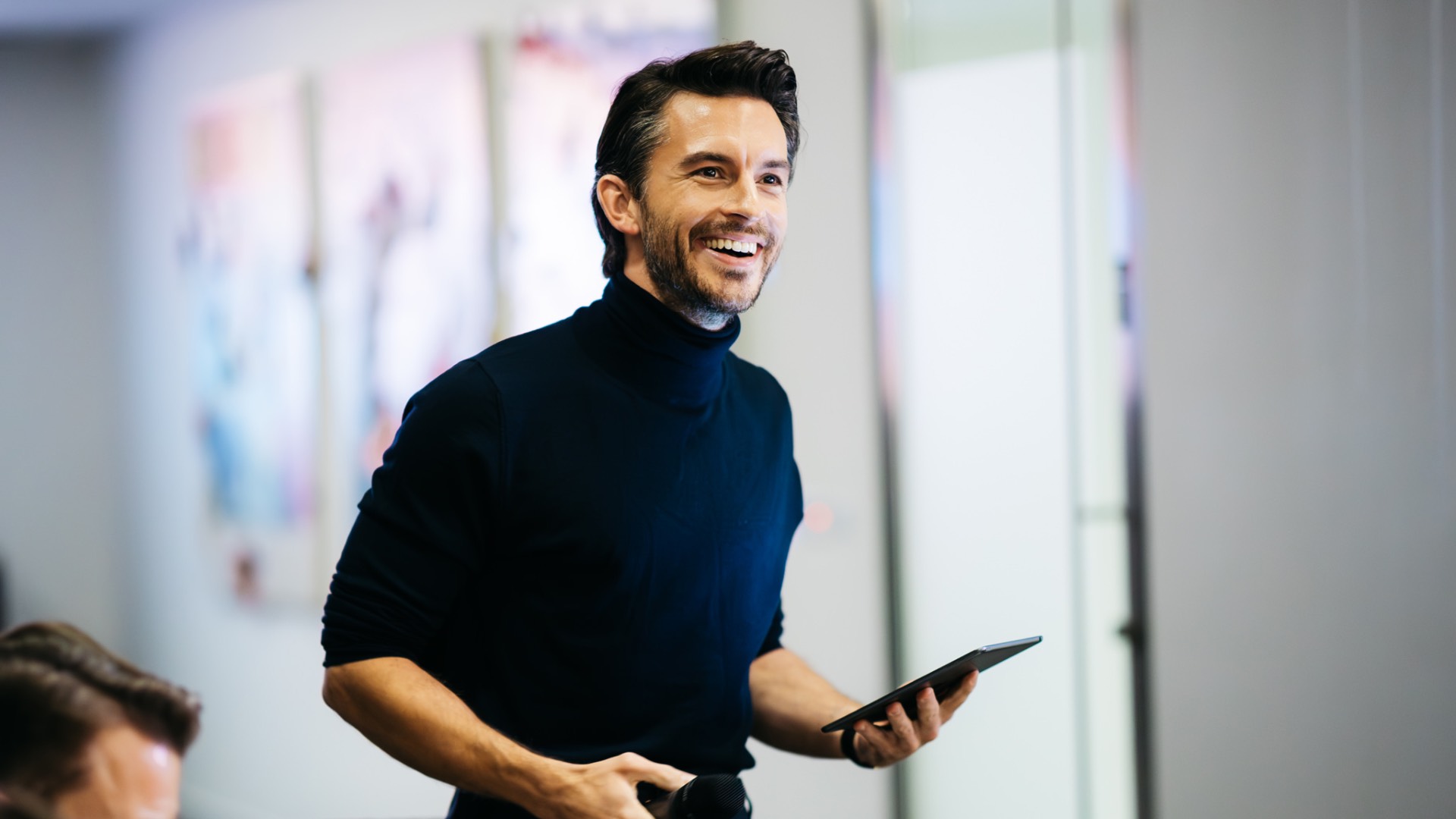 Jonathan Bailey in black turtle neck