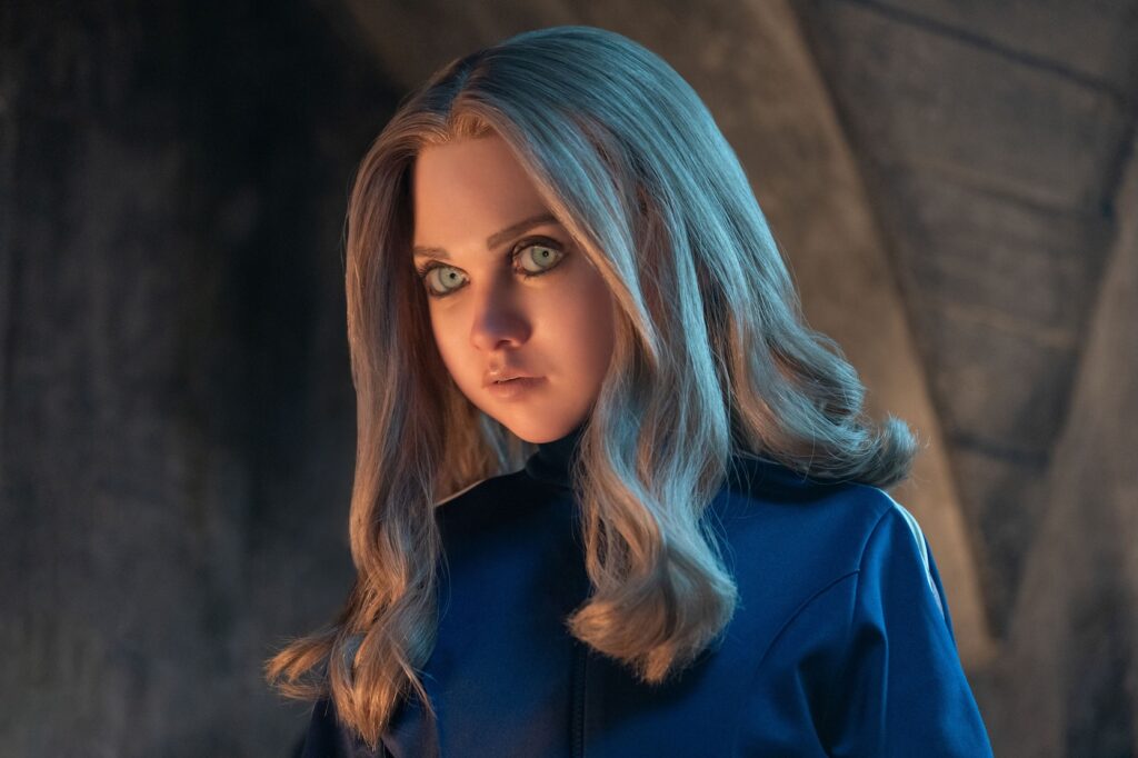 head and shoulders of Megan wearing blue, with long hair
