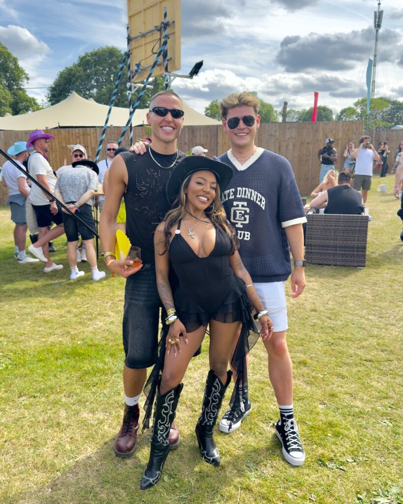 Ash Holme, and Jack Remmington in black posing with Ashley on festival site (Image: Author's own)