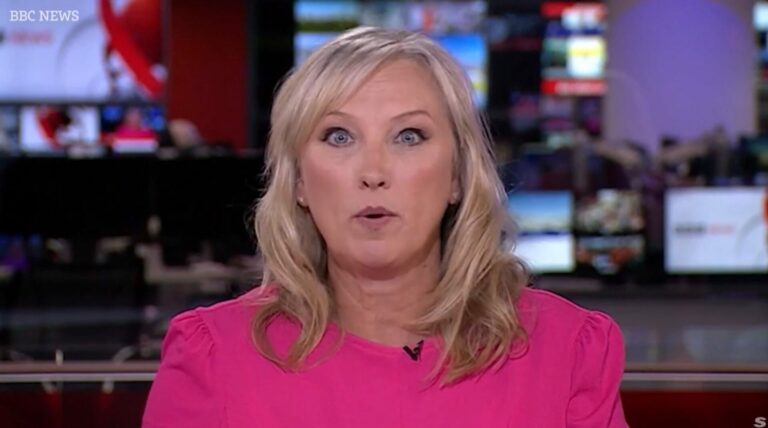 BBC News anchor Martine Croxall in a pink top in studio during yesterday's broadcast (Image BBC)