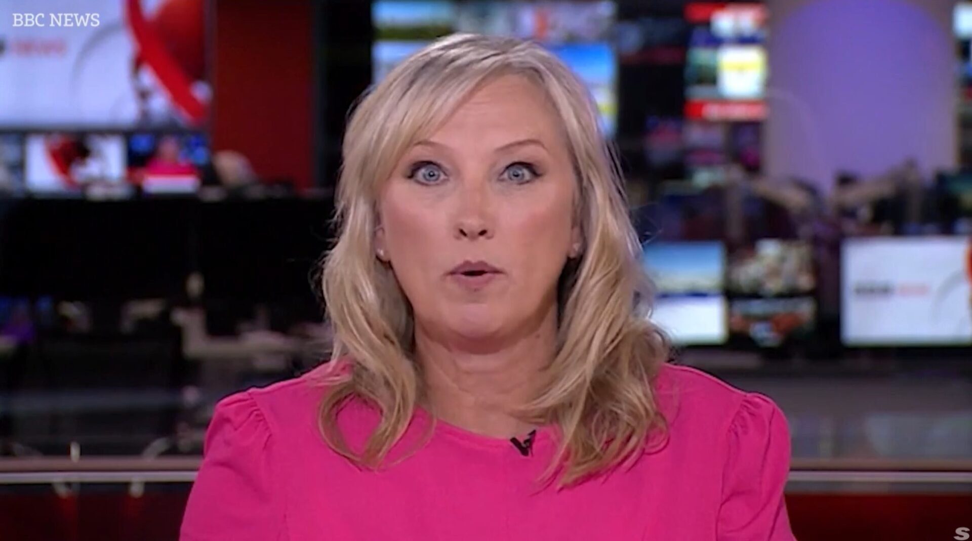 BBC News anchor Martine Croxall in a pink top in studio during yesterday's broadcast (Image BBC)