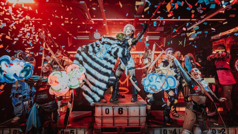 Performers on stage at Oscar at the Crown, with confetti falling