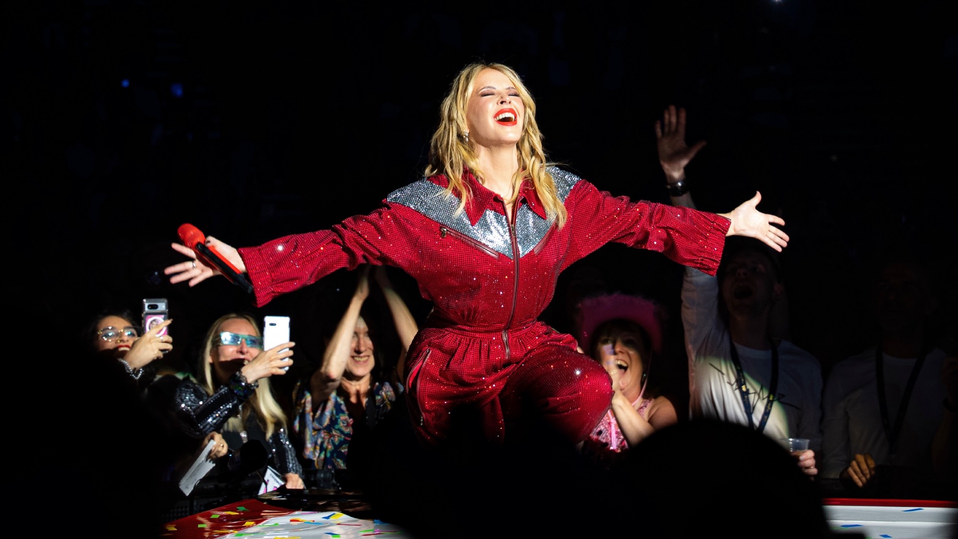 Kylie Minogue on stage at The O2 in London last night, in a red cowgirl jumpsuit