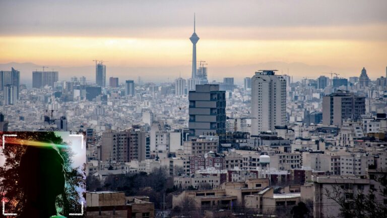 A portrait image of a man's darkened face sitting over a view of the Tehran skyline