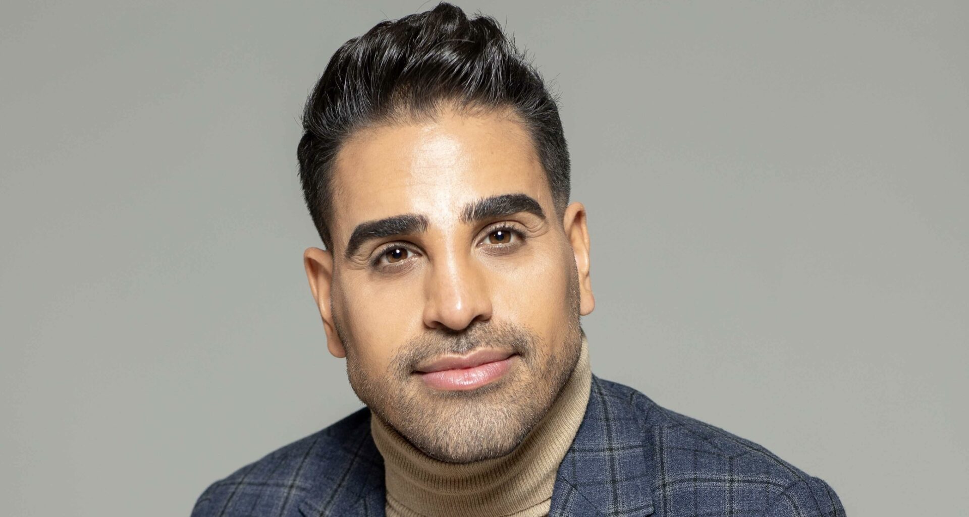 Dr Ranj Singh, head and shoulders against grey background