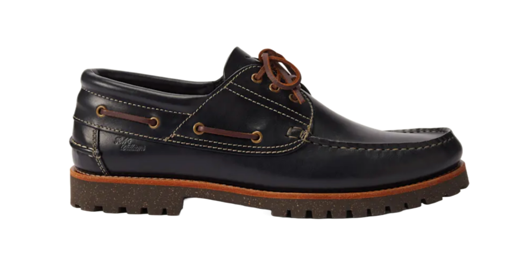 Navy leather boat shoe with contrast stitching, brown laces and sole
