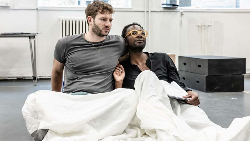 Lincoln and Douglas rehearsing, lying on floor