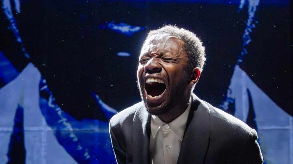 Omari Douglas screaming on stage at This Bitter Earth