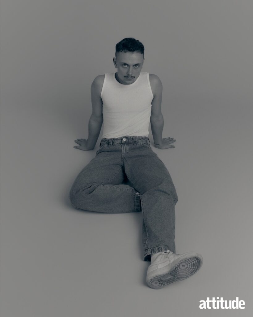 Lars sat down in jeans and white vest