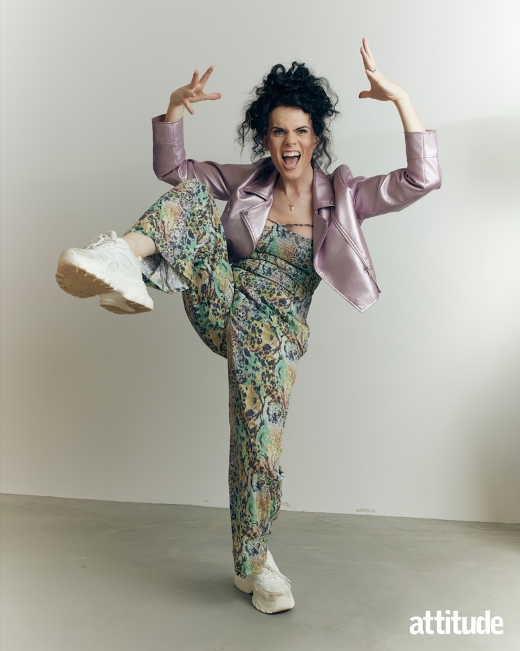 Jordan in a purple jacket and patterned jumpsuit