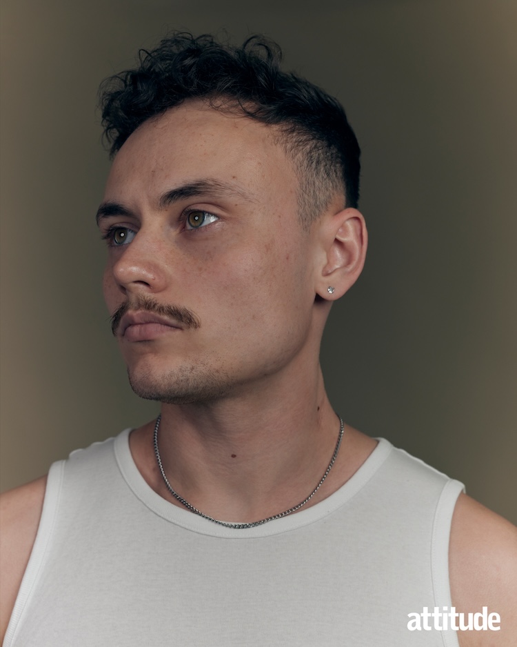 close up of Lars in a white vest