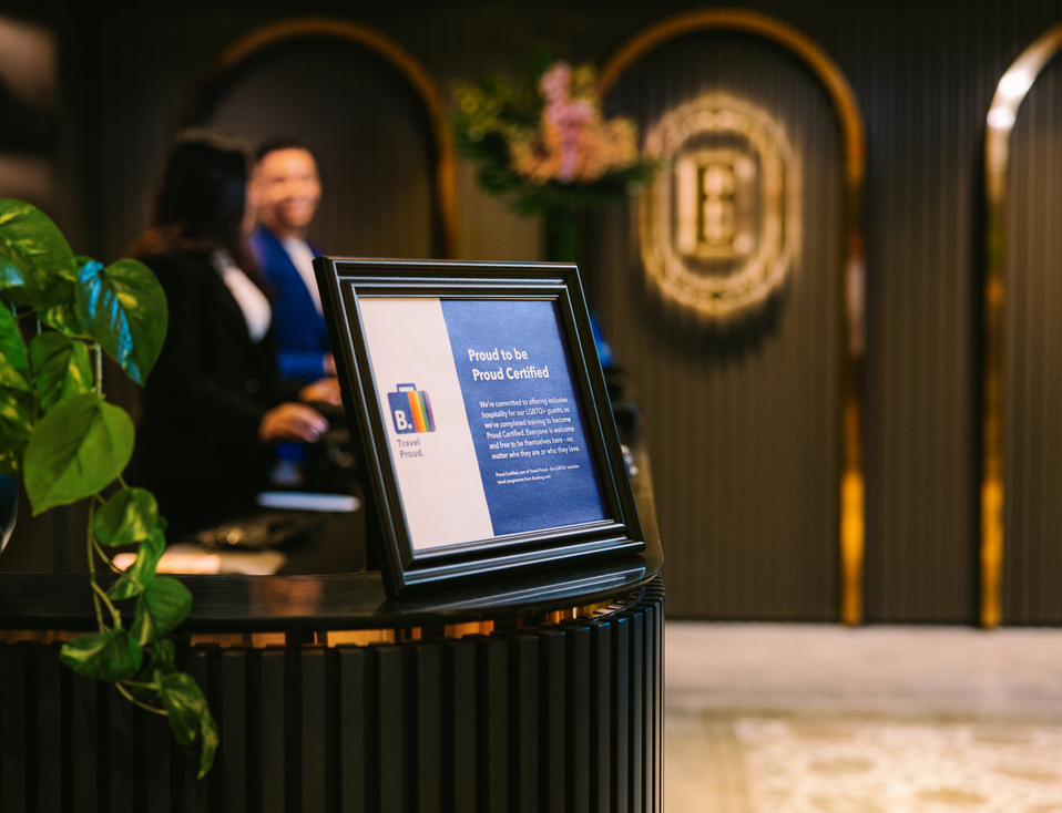 Travel Proud certificate displayed in a hotel lobby