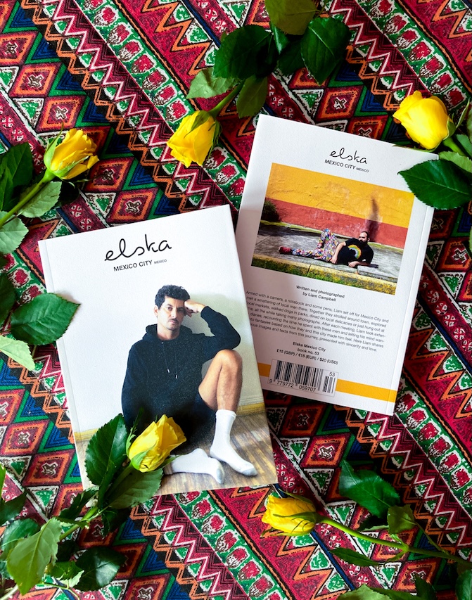 elska front and back covers on a patterned tablecloth with yellow roses