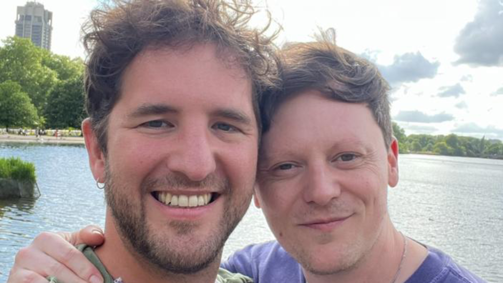 Adam J Miller with boyfriend Henry Fry in front of a lake