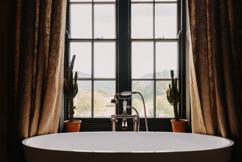 a bathtub by a window