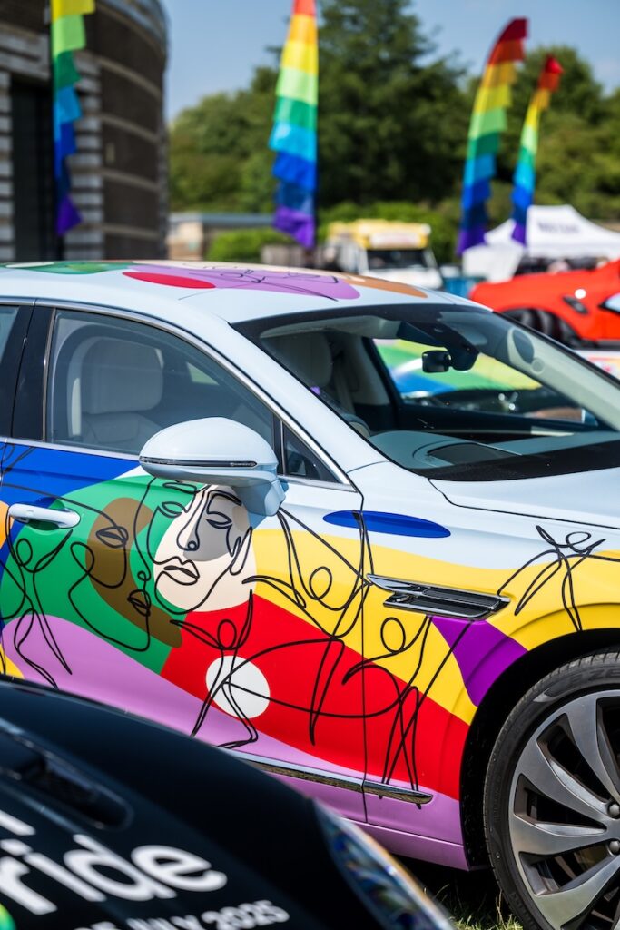 Colourful car wrapped in rainbow art