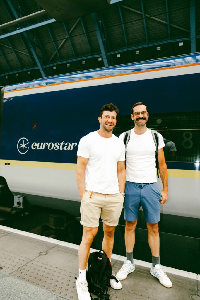 Two man standing in front of a Eurostar train