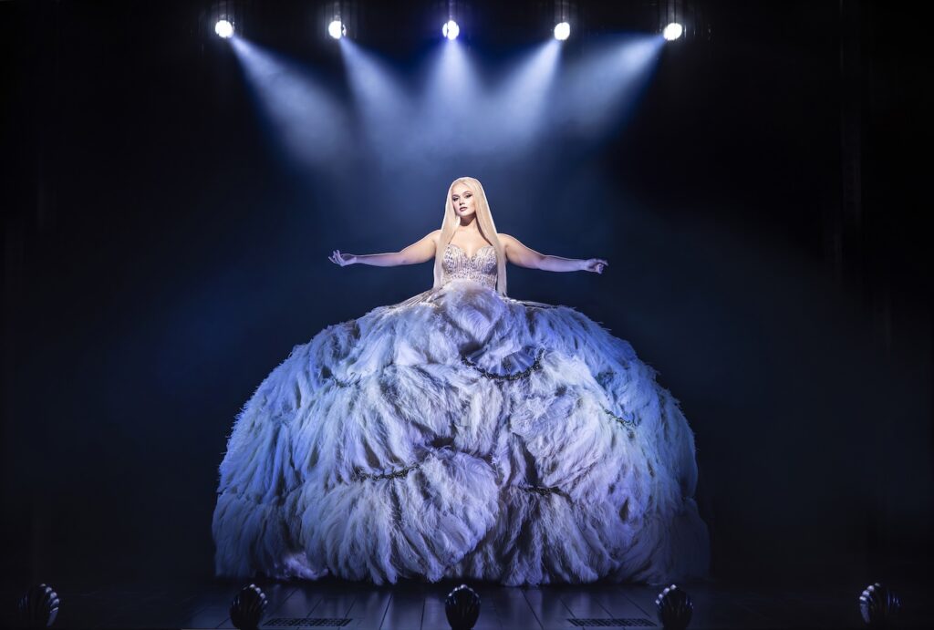 Jess Folley as Ally in Burlesque - in a dress with a skirt made of white ostrich feathers