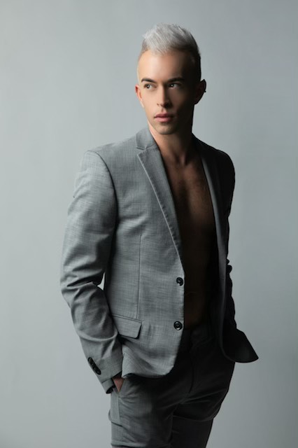 a portrait shot of the author in a grey blazer