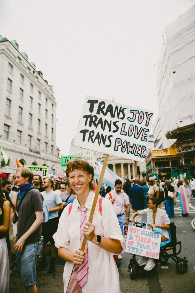 “trans joy trans love trans power” sign