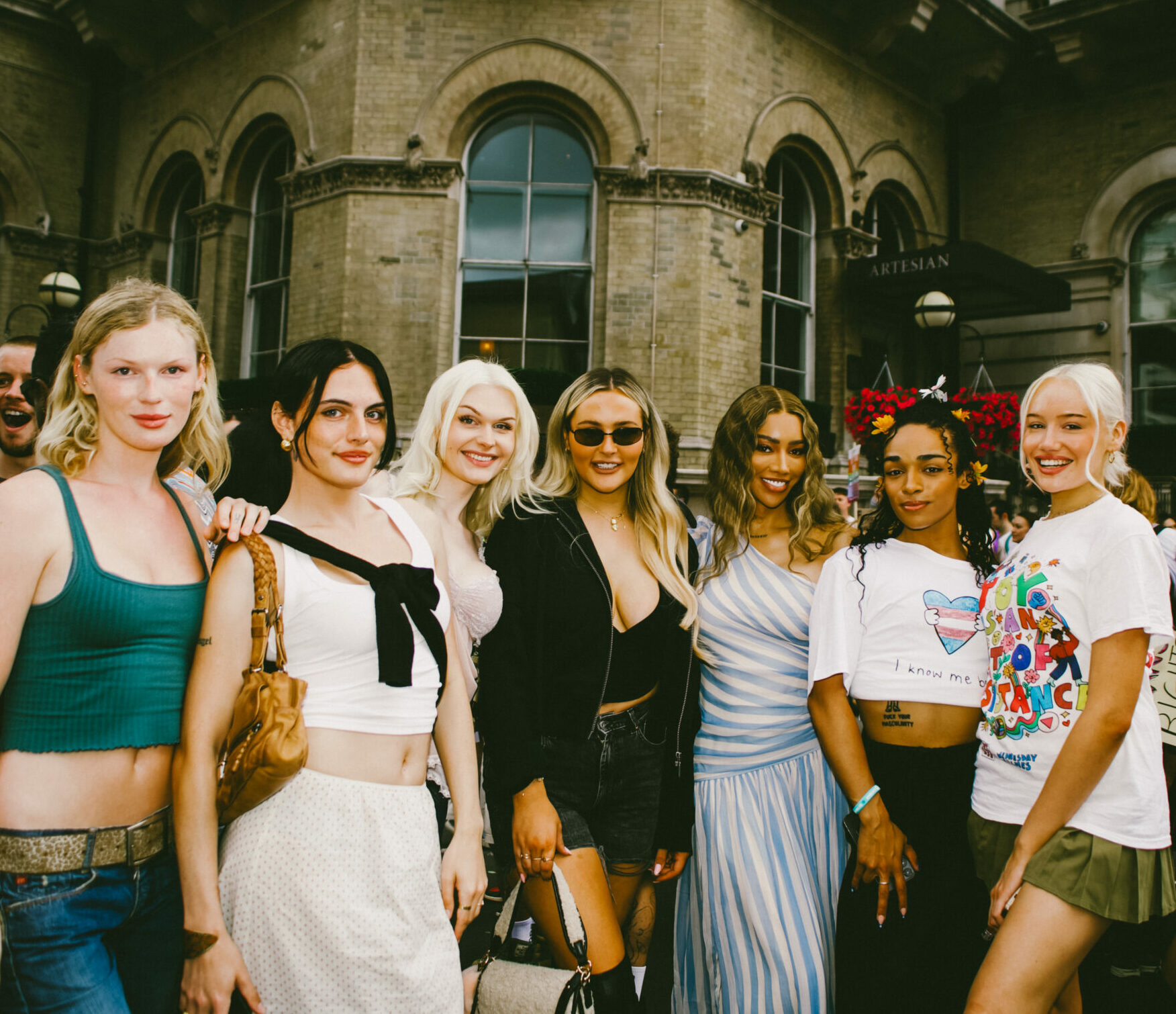 Trans influencers and content creators join forces smiling proudly at the camera