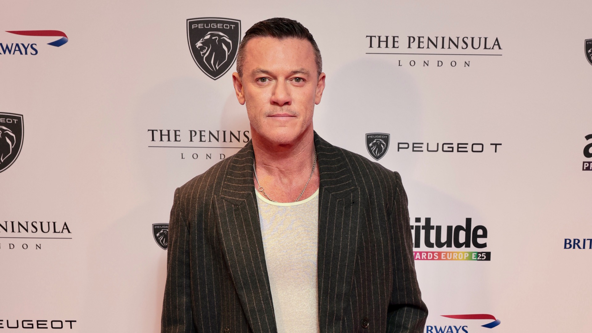 Luke Evans in a black jacket on red carpet (Image: Attitude/Kit Oates)