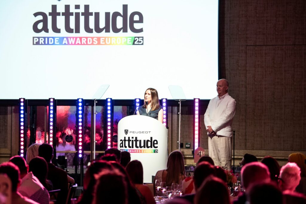 Nicola Dobson gives a speech on stage at the PEUGEOT Attitude PRIDE Awards Europe 2025