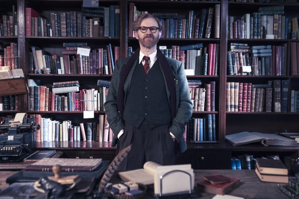Mark in character wearing collar and tie