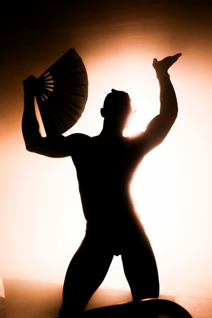 Shadow of a man dancing with a fan