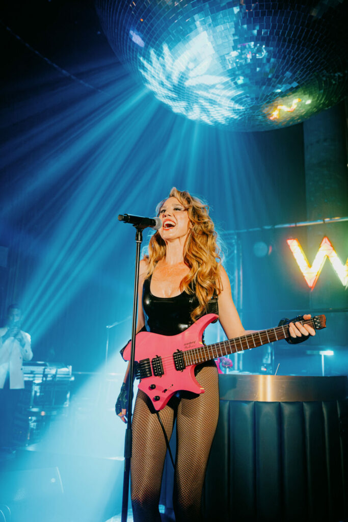 Beks performing under Europe's largest mirrored disco ball in the W London