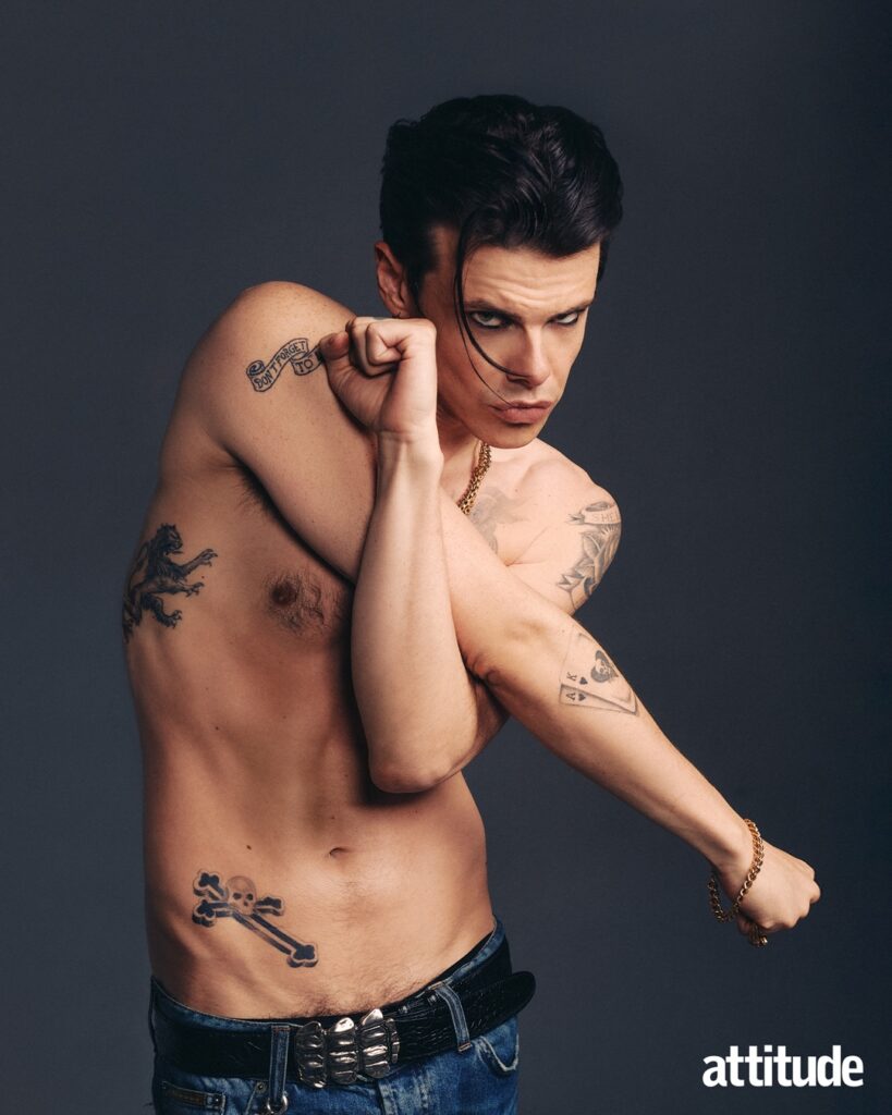 Yungblud topless punching the air