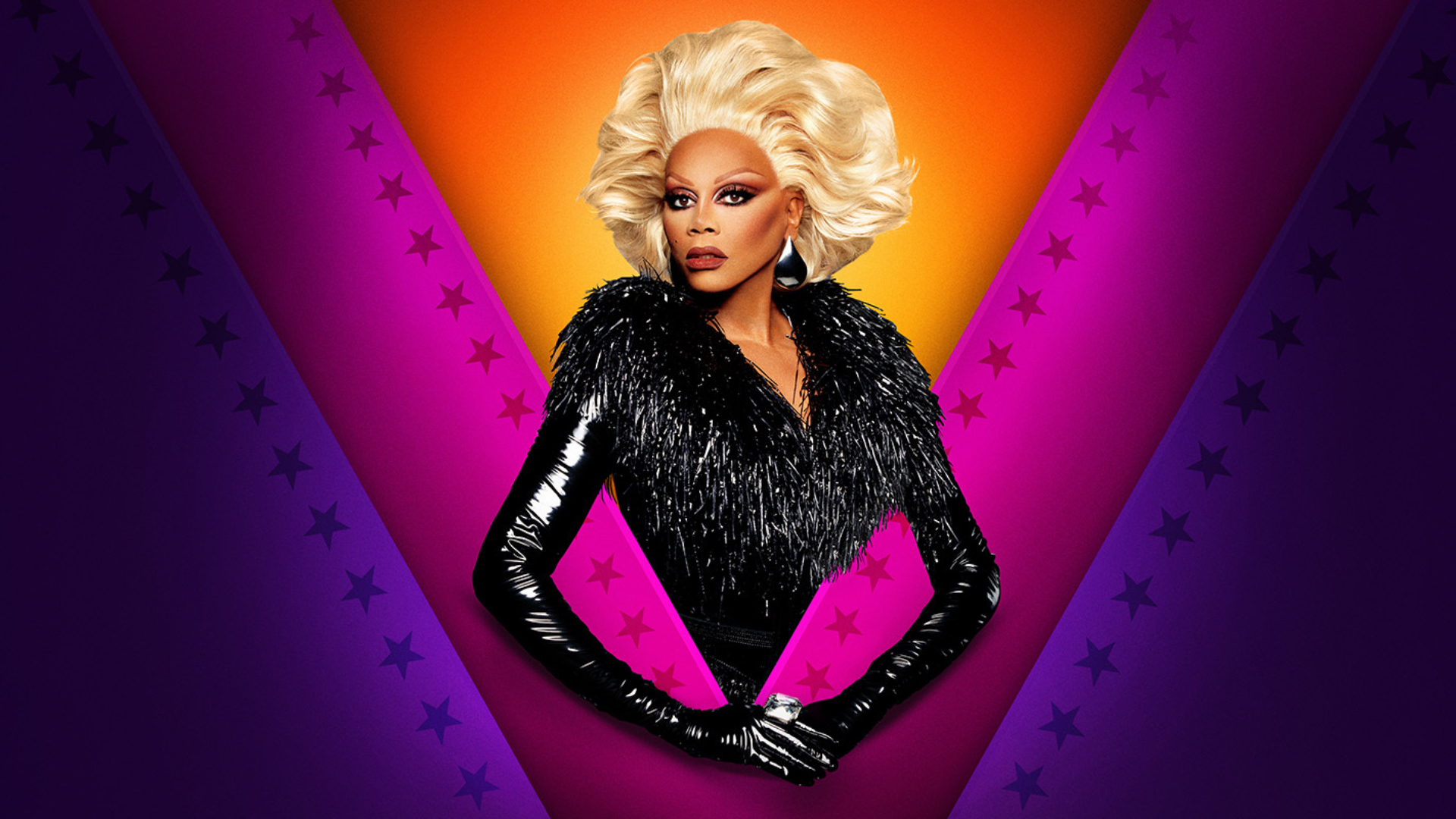 RuPaul in a blonde wig and black feathered sequinned dress