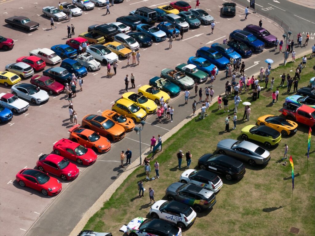 Cars lined up to make a rainbow