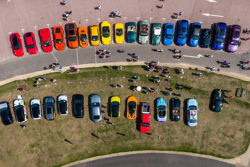 Cars lined up to make a rainbow